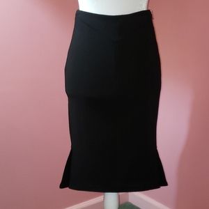One Roland Mouret black skirt